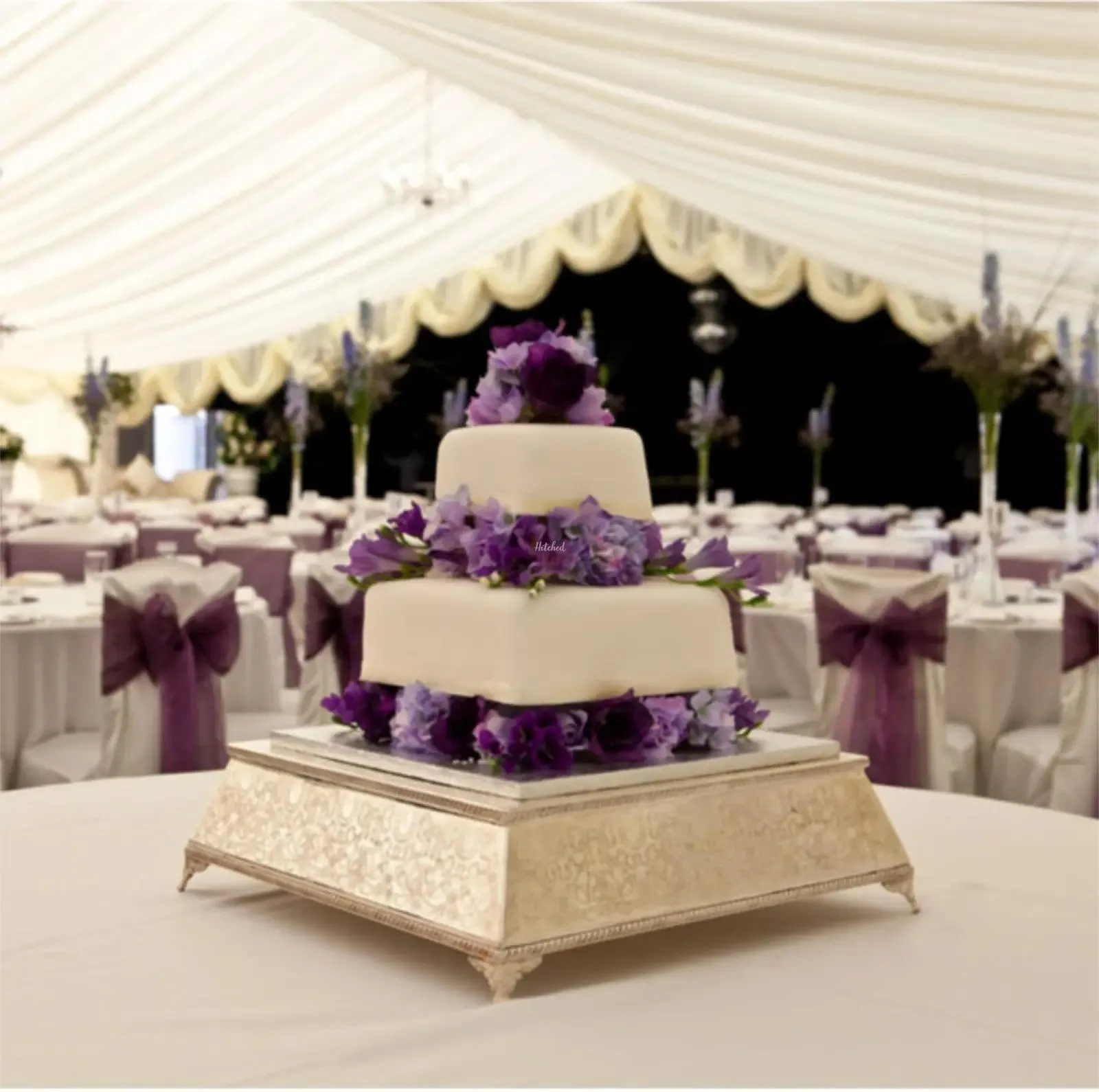Tiered wedding cake with lilac flowers